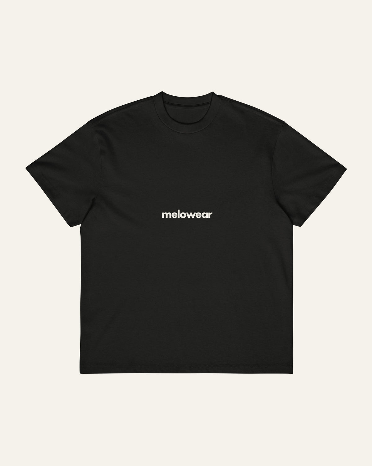 Front of the black melowear let the story unfold tee with the wordmark small across the chest